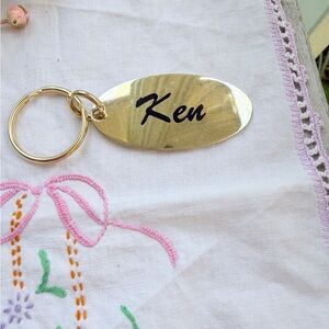 Brass Oval Keychain with Black Lettering “Ken”